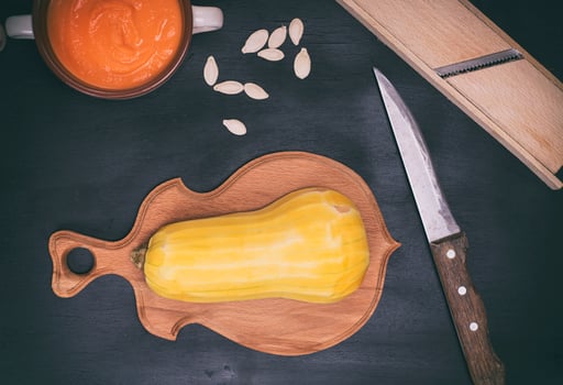pumpkin on brown cutting board photo