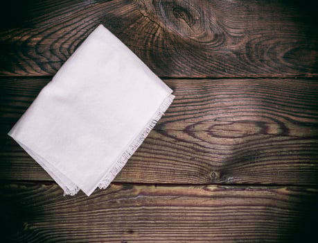 kitchen napkin on a brown wooden background photo