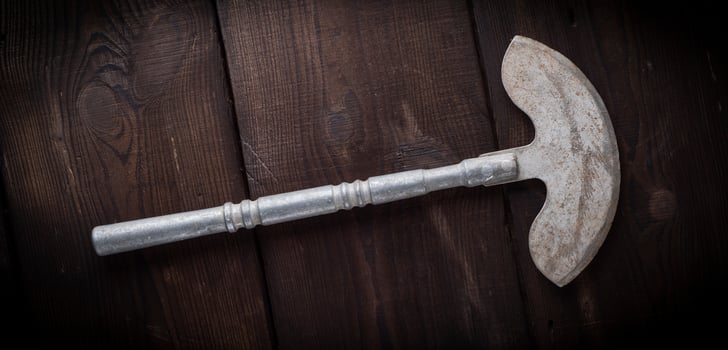 very old iron hatchet for cutting meat photo