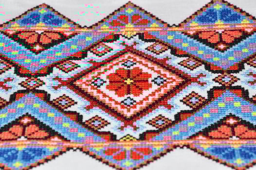 Geometric pattern embroidered cross photo