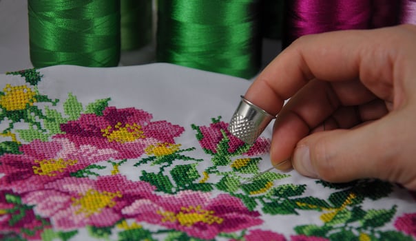 Process cross stitch flower ornament photo