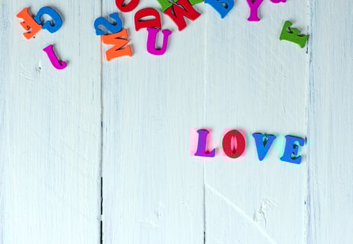 white wooden background with the word love photo