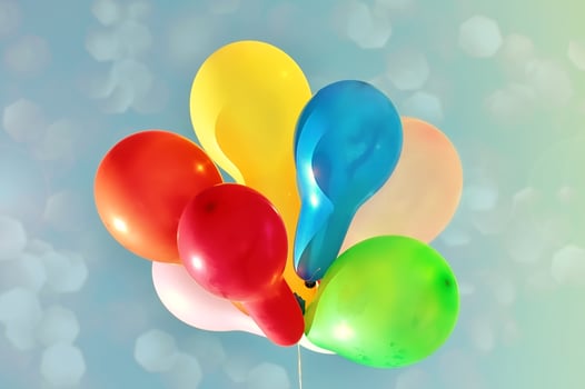 Multicolored balloons against the sky photo