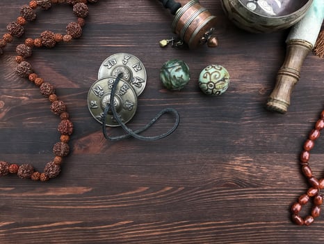 Tibetan religious accessories for ritual and meditation in Buddhism, brown wooden table photo