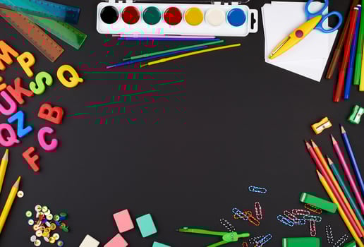 school supplies multicolored wooden pencils, paper stickers, paper clips photo