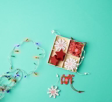 burning christmas garland on a white wire with colorful lights photo