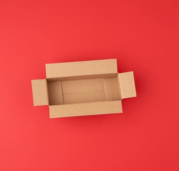 open empty square brown cardboard box for transportation and packaging of goods photo
