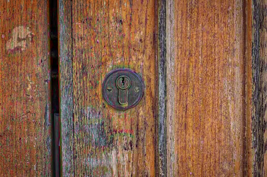 Lock on a brown shabby door, photo