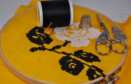 hoop with the embroidery on the fabric with a cross photo