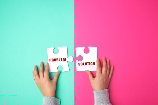 two empty paper white pieces of puzzles in female hands, puzzle connected photo