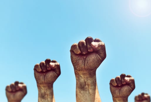 Many male hands are clenched in the fist photo