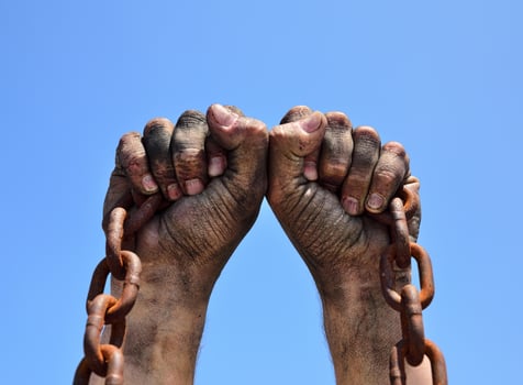 Two male hands are raised up photo