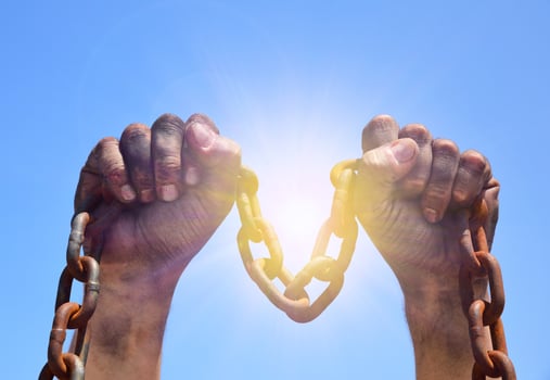 Two male hands are raised upwards photo