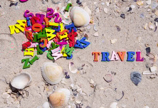 word travel is made up of small multicolored  letters photo