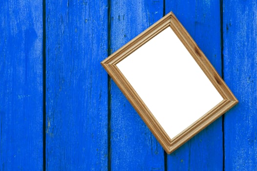 Wooden frame for photo on the blue wooden old background