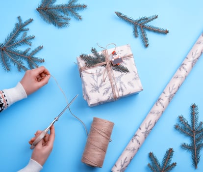 gift wrapped in pink paper and tied with a brown rope photo