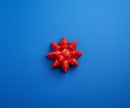 Beautiful abstract blue design template with red bow photo