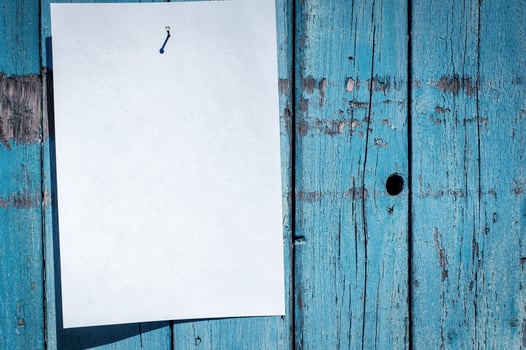blank white piece of paper hanging on a nail photo