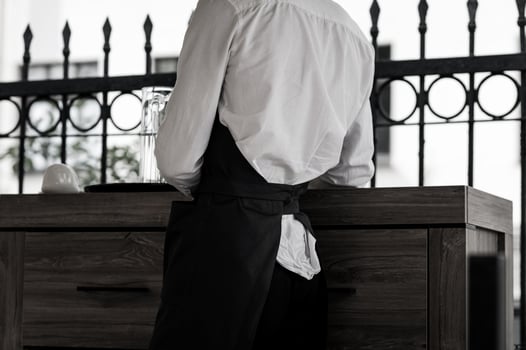 waiter wearing black apron photo