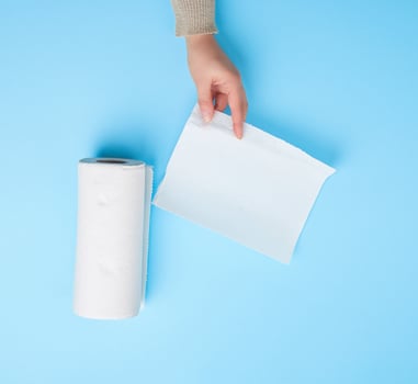 female hand holding a clean white paper napkin for face and body photo