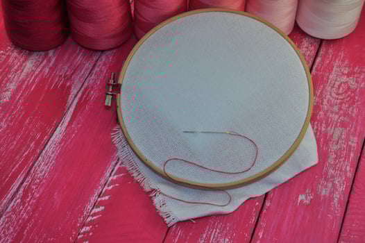 The fabric in the wooden embroidery hoop for hand photo