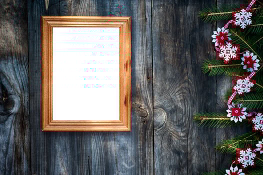 Empty wooden frame on the gray wooden surface photo