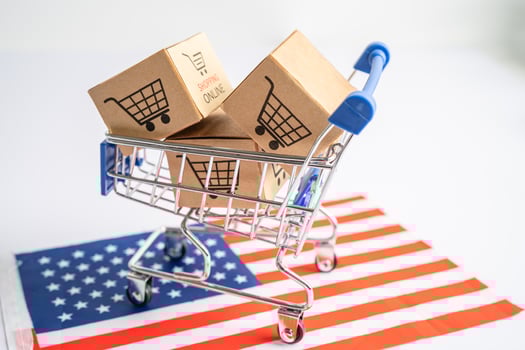 Box with shopping cart logo and USA America flag, Import Export Shopping online or eCommerce finance delivery service store product shipping, trade, supplier concept. photo