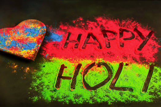 Holi background with colored powder. Holi festival, traditional Indian holiday. Happy holi lettering. photo