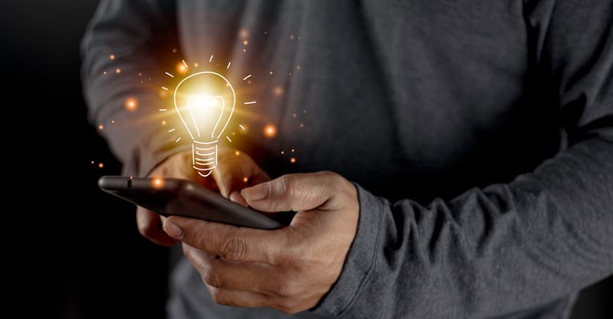 hand holding light bulb. idea concept with innovation and inspiration. Bulb light drawing idea in hand photo