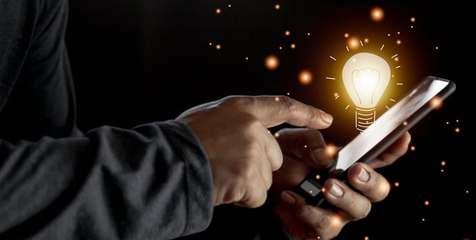 hand holding light bulb. idea concept with innovation and inspiration. Bulb light drawing idea in hand photo