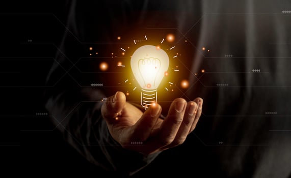 hand holding light bulb. idea concept with innovation and inspiration. Bulb light drawing idea in hand photo