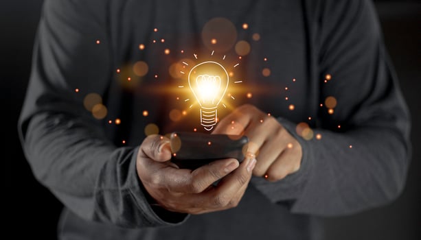hand holding light bulb. idea concept with innovation and inspiration. Bulb light drawing idea in hand photo
