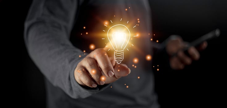hand holding light bulb. idea concept with innovation and inspiration. Bulb light drawing idea in hand photo