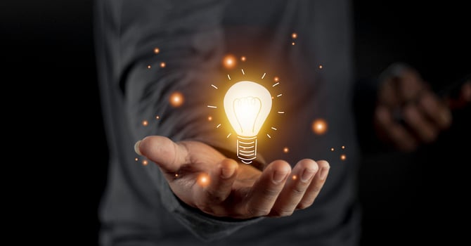 hand holding light bulb. idea concept with innovation and inspiration. Bulb light drawing idea in hand photo