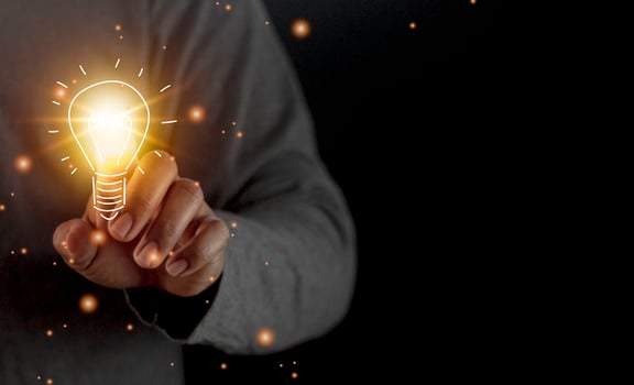 hand holding light bulb. idea concept with innovation and inspiration. Bulb light drawing idea in hand photo