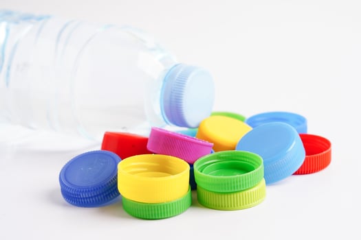 Plastic bottle caps colorful for recycle on white background. photo