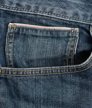 front pocket of blue classic jeans, full frame photo