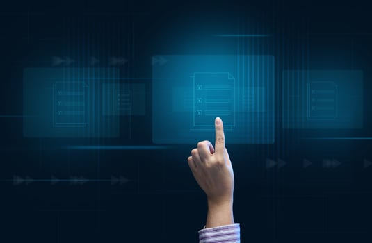 a female hand checks documents on a holographic screen. The concept of compliance control, documents with a mark photo