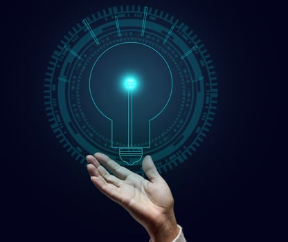 holographic lamp and female hand on a dark blue background. Concept of new ideas, brainstorming. Opening a profitable business photo
