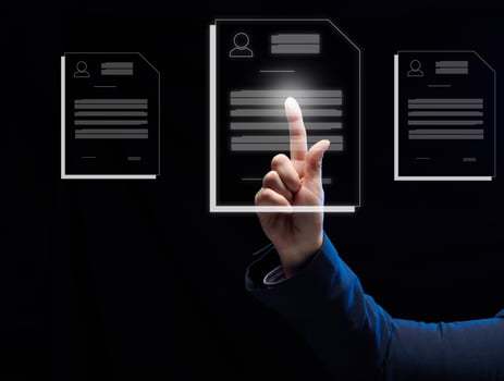 a female hand selects a candidate's resume on a virtual screen. The concept of finding employees, career advancement photo