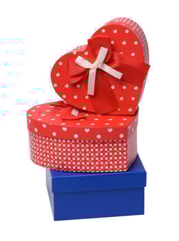 Stack of boxes wrapped in paper and tied with a silk ribbon on a white background, celebration photo
