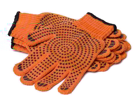 Textile orange work gloves on a white background. Protective clothing photo