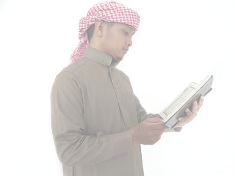 Indonesia. 31 January 2023. Photo of man reading a quran ready for Ramadan.