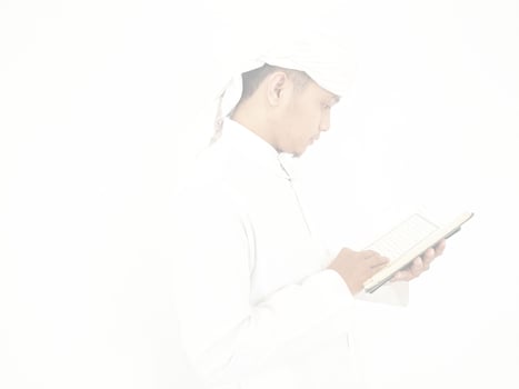 Indonesia. 31 January 2023. Photo of man reading a quran ready for Ramadan.
