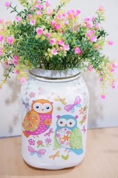 Beautiful summer flowers in a cup as background photo