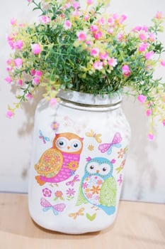 Beautiful summer flowers in a cup as background photo