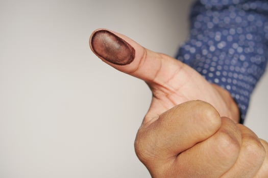 putting fingerprints on a paper close up , photo