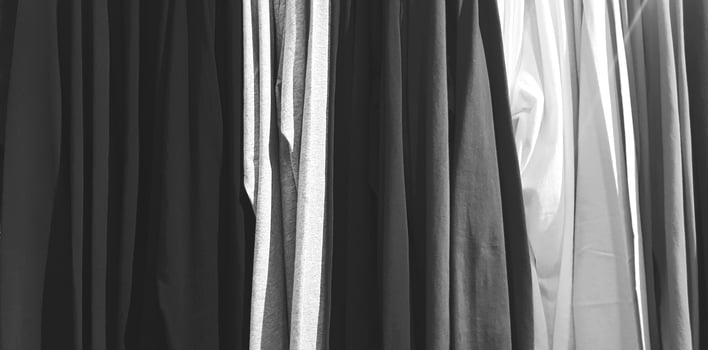 Art pattern of clothing, cotton or fabric hanging in line at fashion store in black and white style for background photo