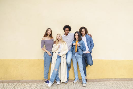 Multi-ethnic group of friends posing while having fun and laughing together photo