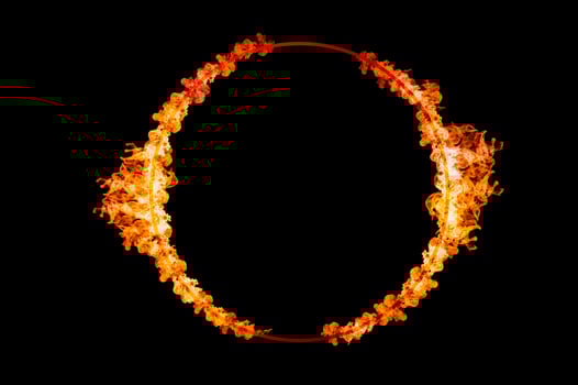 orange flame circle frame on black background photo